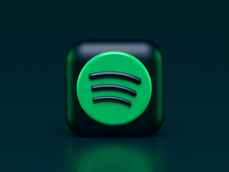 Person holding smartphone with Spotify app open showing playlist sharing options